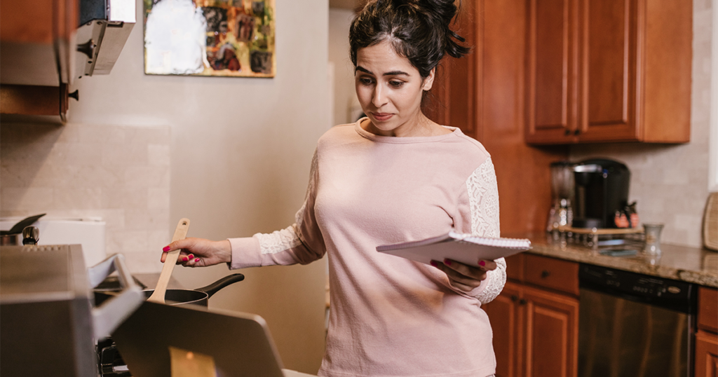 a women taking a virtual cooking class with her team to improve team collaboration