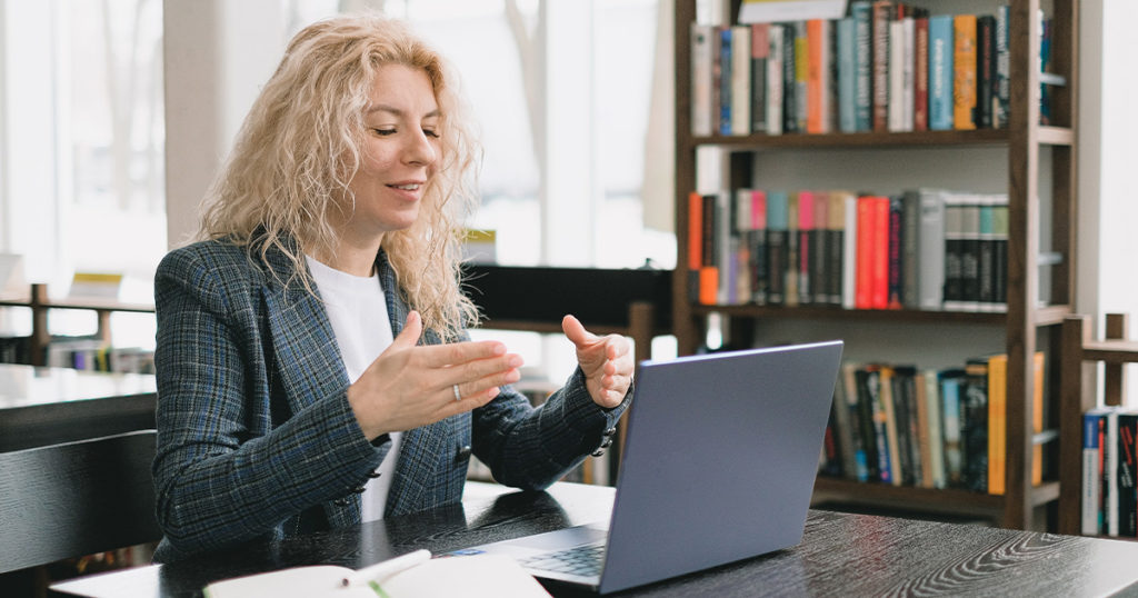 A woman on a virtual meeting with her remote team