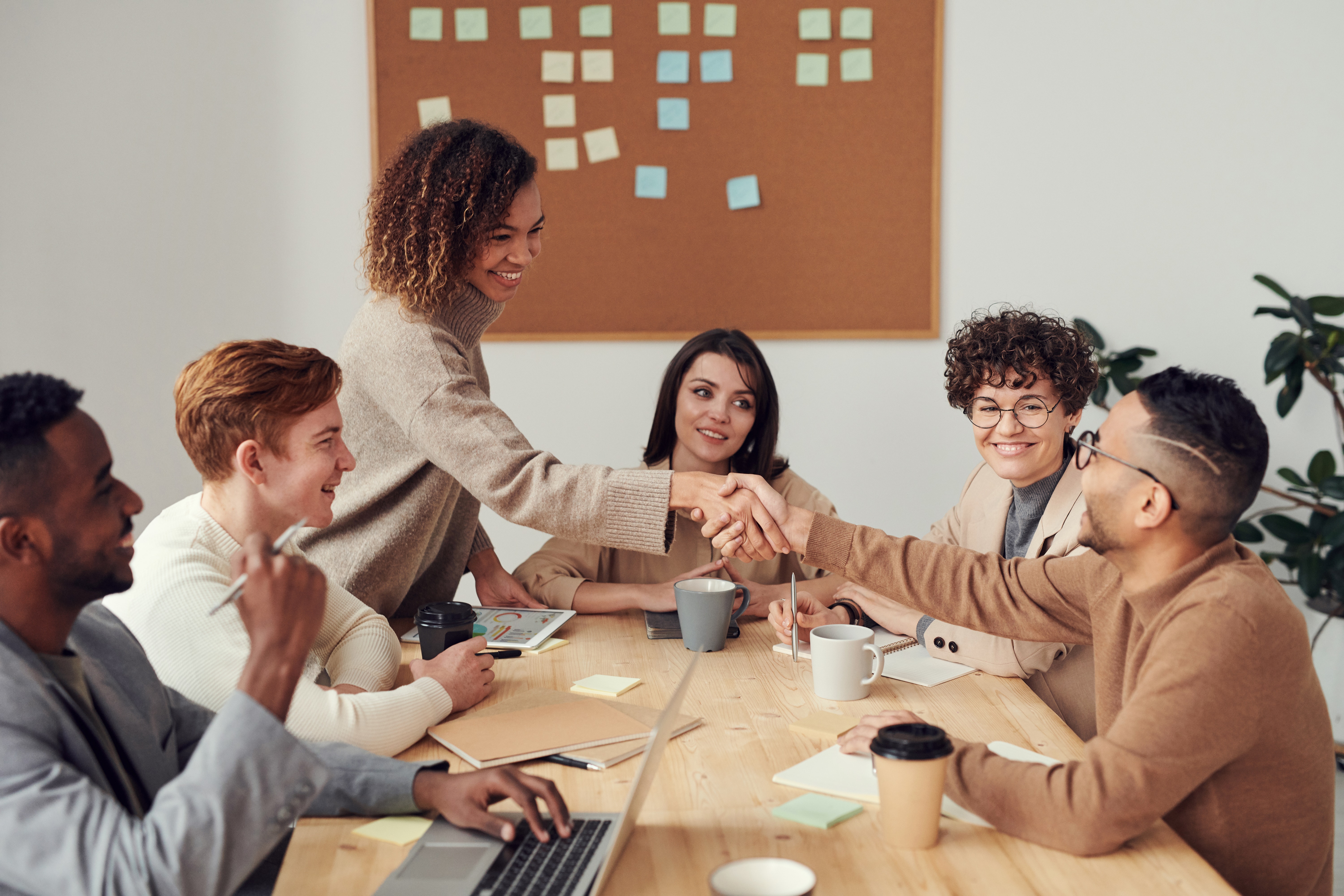 group of people collaborating at a table.